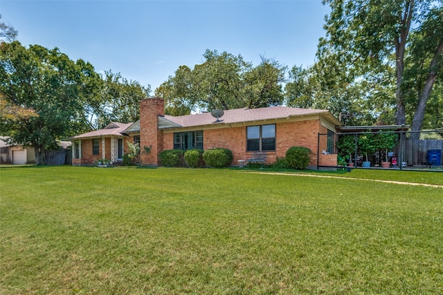 single story home with a front yard