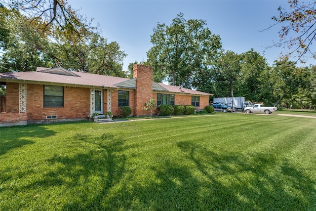 ranch-style home with a front yard