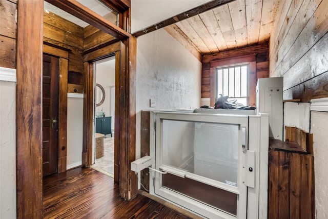 bathroom featuring wooden ceiling, wood walls, and wood finished floors