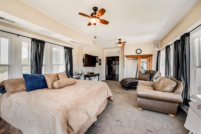 bedroom with ceiling fan, carpet flooring, and visible vents