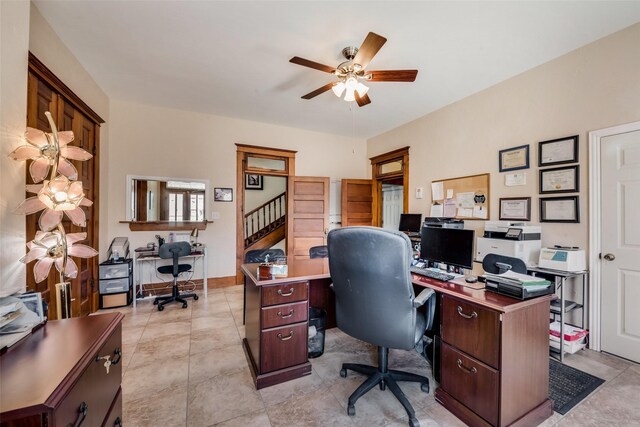 office area featuring light tile patterned floors, ceiling fan, and baseboards