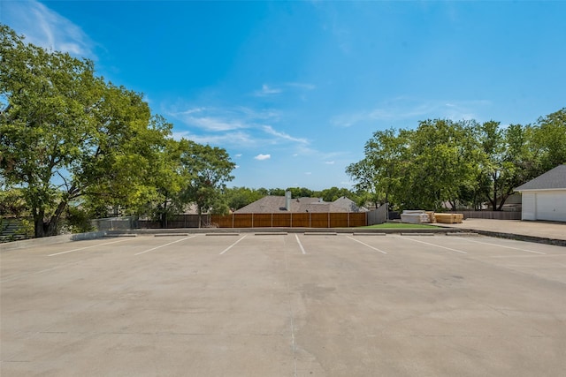 uncovered parking lot with fence