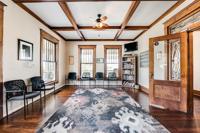 sitting room with ceiling fan, wood finished floors, coffered ceiling, beamed ceiling, and baseboards