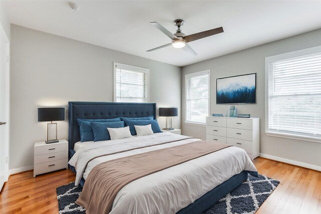 bedroom with ceiling fan and light hardwood / wood-style flooring