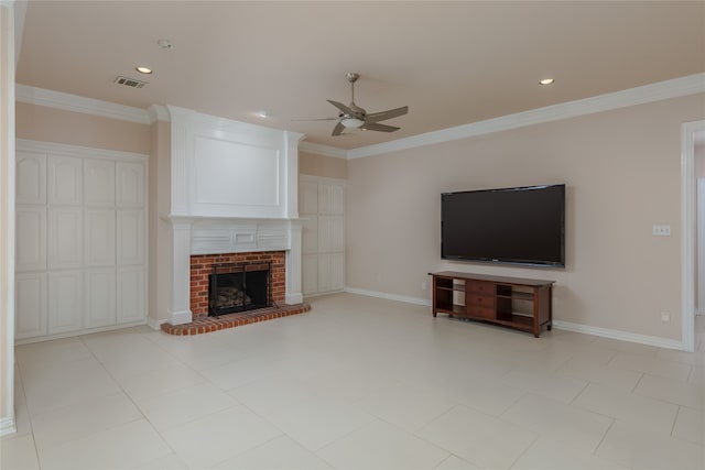 unfurnished living room featuring ceiling fan, crown molding, light tile patterned floors, and a brick fireplace