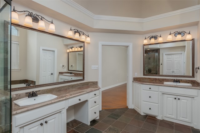 bathroom featuring crown molding, vanity, walk in shower, and tile patterned floors