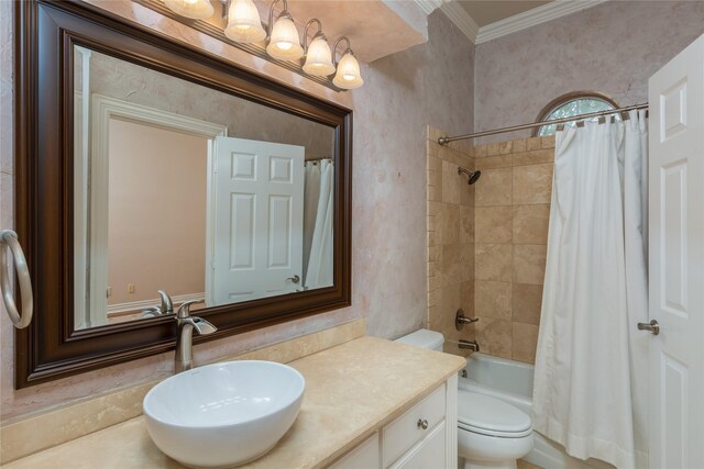 full bathroom with crown molding, toilet, shower / bath combo with shower curtain, and vanity