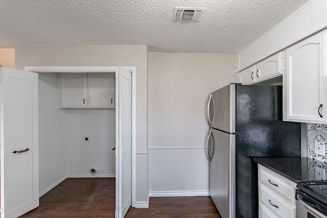 kitchen with white cabinetry, dark hardwood / wood-style floors, and a textured ceiling