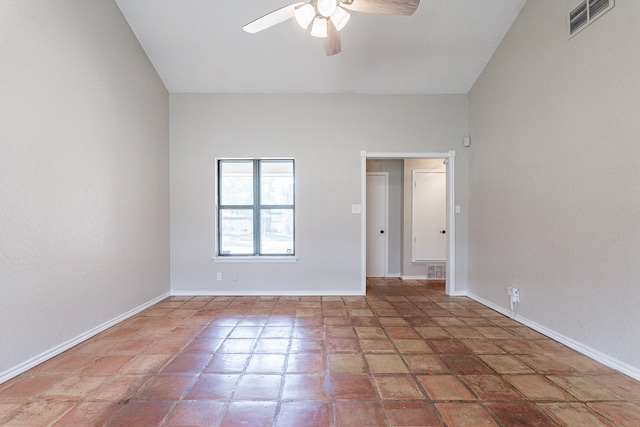 unfurnished room featuring ceiling fan and tile patterned flooring