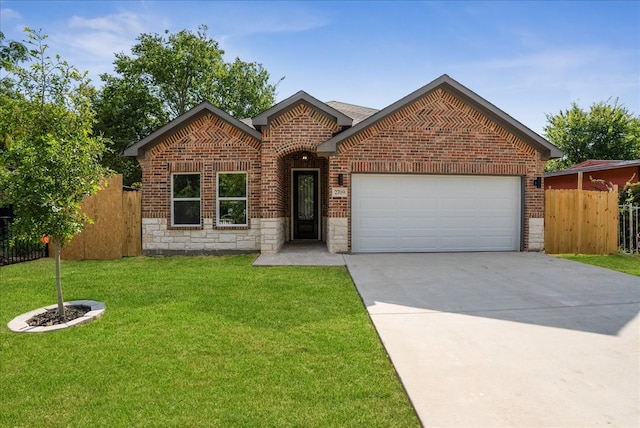 view of front of home featuring a front lawn and a garage