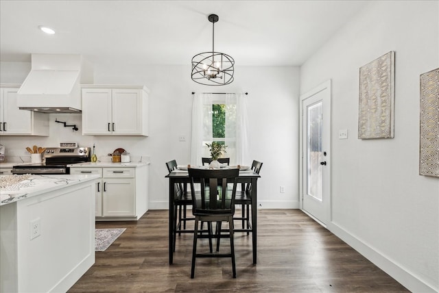 kitchen with pendant lighting, electric stove, custom exhaust hood, dark wood-type flooring, and white cabinets