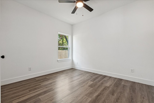 unfurnished room featuring ceiling fan and dark hardwood / wood-style floors