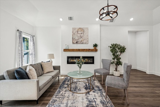 living room with dark hardwood / wood-style flooring