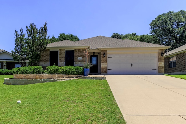 single story home featuring a garage and a front lawn