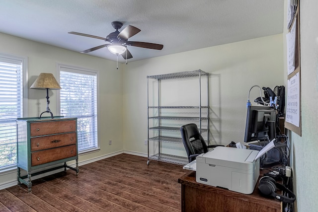 office with plenty of natural light, dark wood-type flooring, ceiling fan, and a textured ceiling