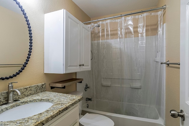 full bathroom featuring vanity, toilet, a textured ceiling, and shower / bath combo