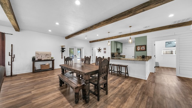 dining area with dark wood-type flooring, beamed ceiling, and french doors