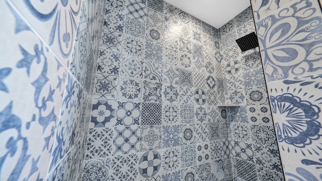 bathroom with tiled shower