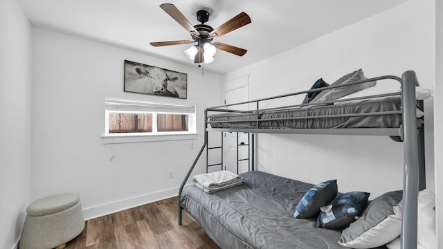 133 Prairie Ln, Weatherford, TX 76087 - bedroom with baseboards, wood finished floors, and a ceiling fan