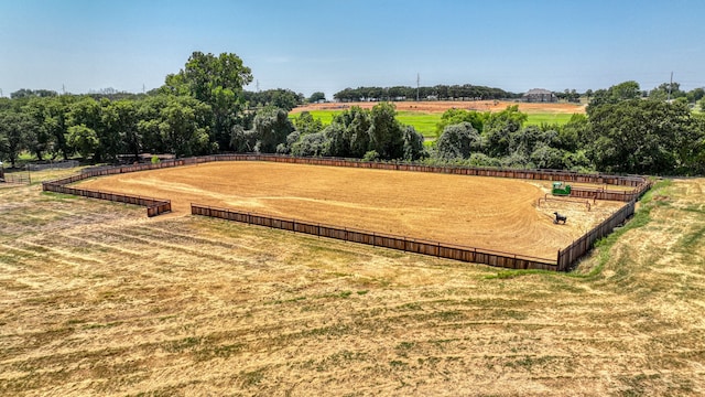 exterior space featuring a lawn and a rural view