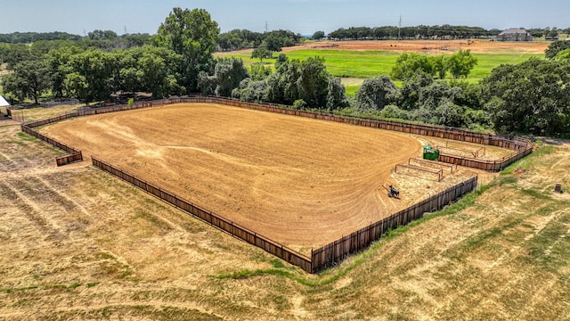 birds eye view of property with a rural view