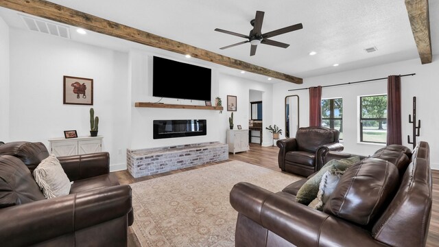 133 Prairie Ln, Weatherford, TX 76087 - living area with a ceiling fan, visible vents, beamed ceiling, and wood finished floors