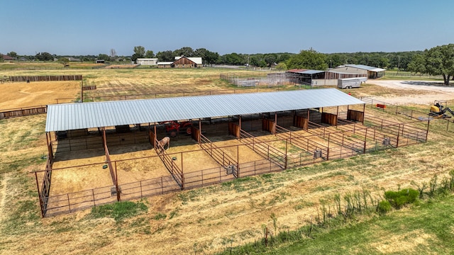 view of horse barn with an outbuilding and a rural view