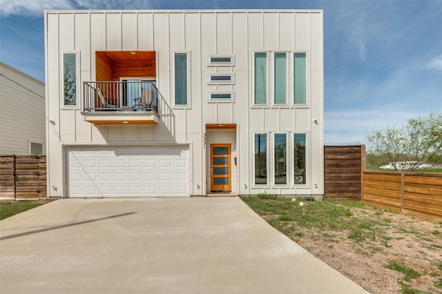 contemporary house with a balcony and a garage