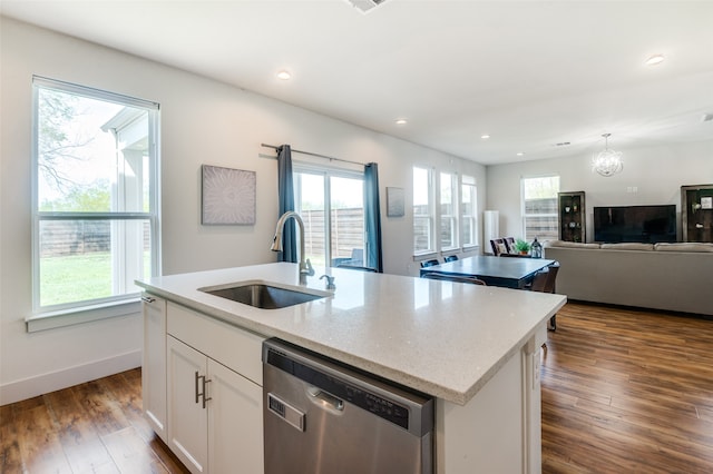 kitchen featuring dishwasher, a healthy amount of sunlight, sink, and dark hardwood / wood-style flooring