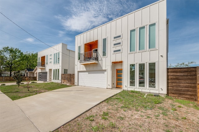 contemporary home with a balcony and a garage