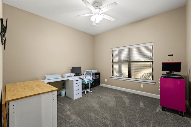 home office featuring ceiling fan and dark colored carpet