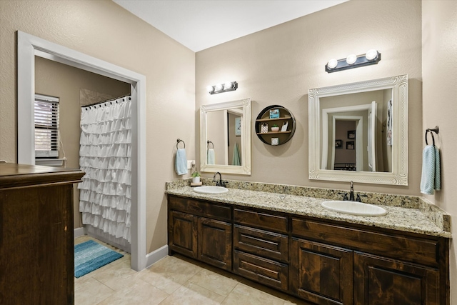 bathroom featuring vanity, a shower with curtain, and tile patterned flooring