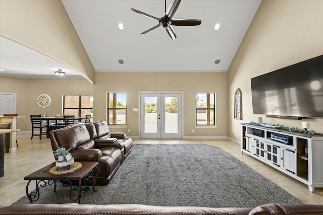 tiled living room with french doors, high vaulted ceiling, and ceiling fan