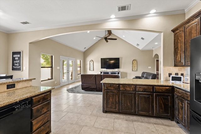 kitchen with black dishwasher, ceiling fan, dark brown cabinetry, and tasteful backsplash