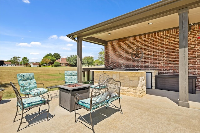 view of patio / terrace with an outdoor fire pit