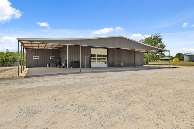 view of outbuilding with a carport