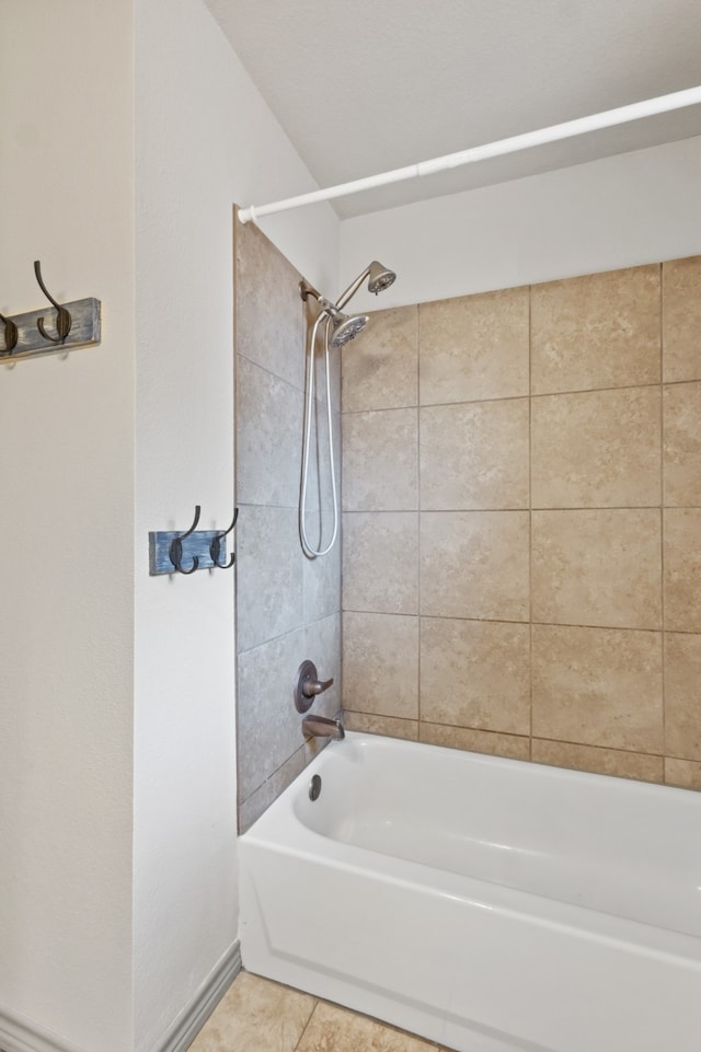 bathroom featuring tiled shower / bath and tile patterned floors