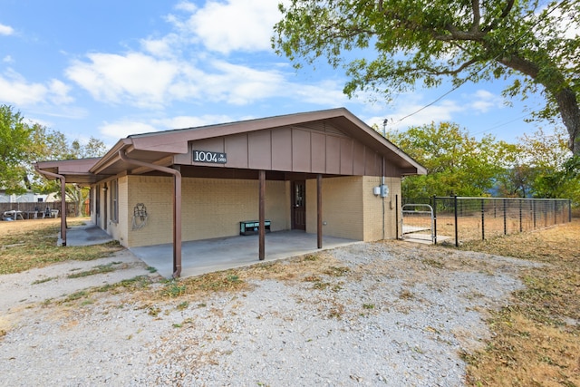 exterior space with a carport