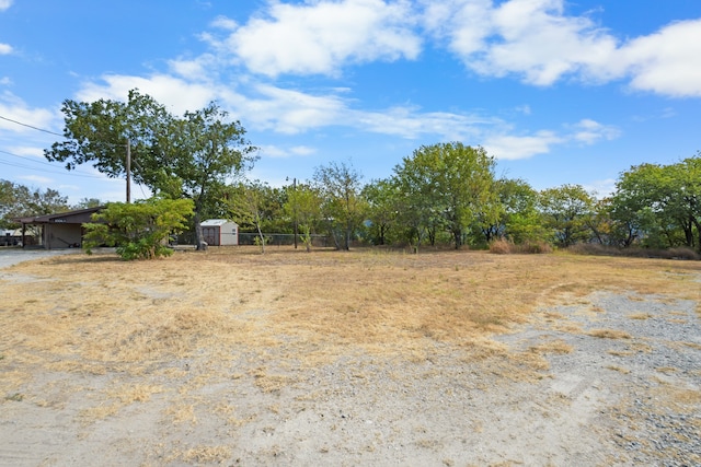 view of yard with a rural view