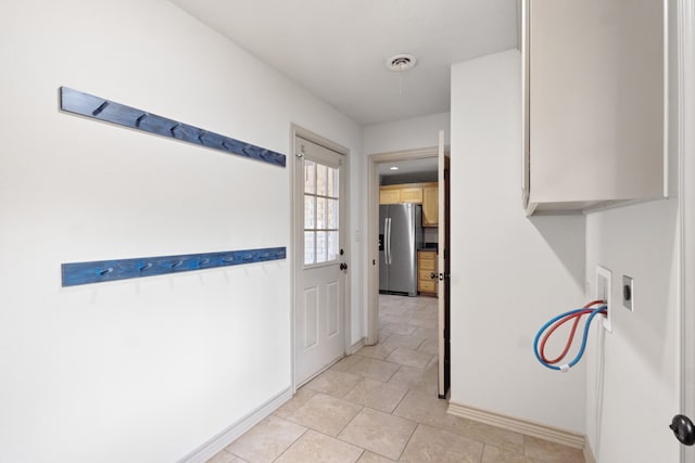 hallway with light tile patterned flooring