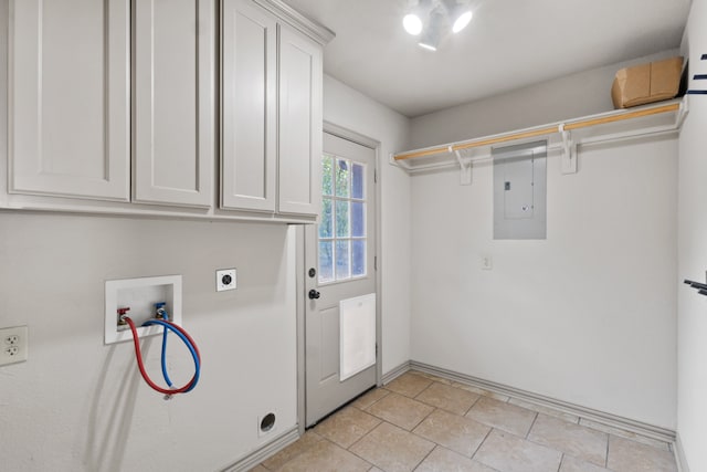 laundry room featuring cabinets, electric dryer hookup, hookup for a washing machine, electric panel, and light tile patterned flooring