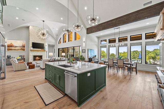 9 Meadowlake Dr, Heath, TX 75032 - kitchen featuring green cabinetry, dishwasher, visible vents, a sink, and a fireplace