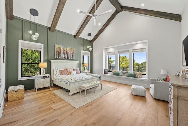 bedroom with light hardwood / wood-style flooring, high vaulted ceiling, and multiple windows