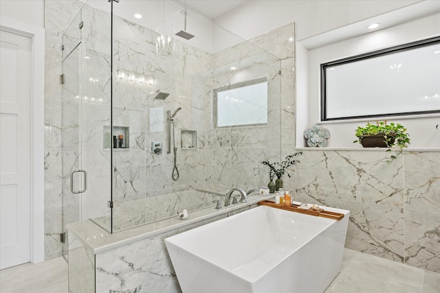 9 Meadowlake Dr, Heath, TX 75032 - bathroom with marble finish floor, a soaking tub, a marble finish shower, and tile walls