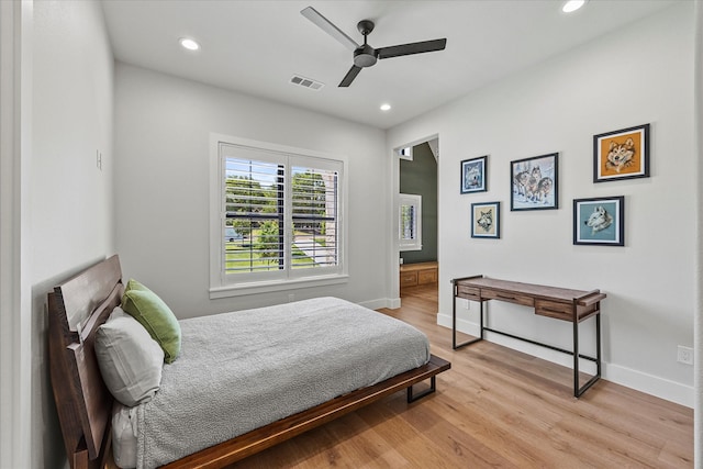 bedroom with light hardwood / wood-style flooring and ceiling fan