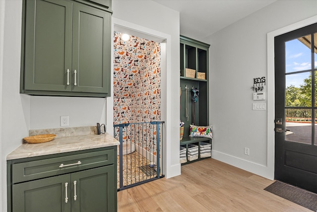 interior space featuring green cabinetry and light hardwood / wood-style floors