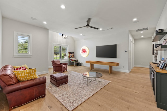 living room featuring ceiling fan and light wood-type flooring