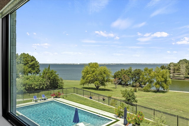 view of pool featuring a water view and a lawn