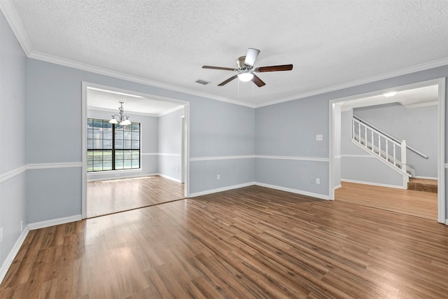 spare room with wood-type flooring and crown molding