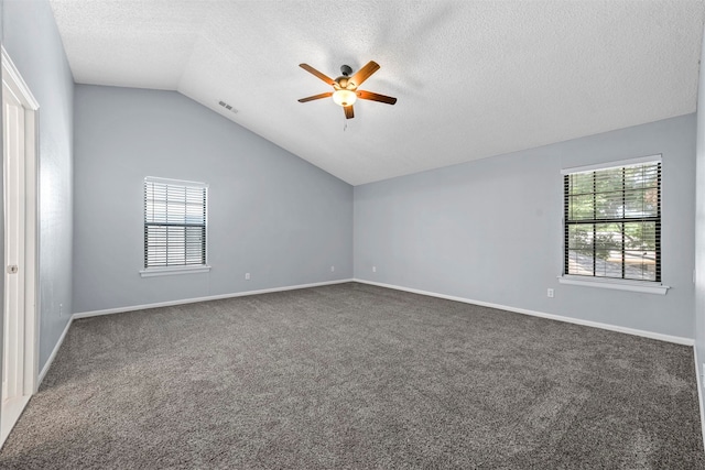 spare room featuring carpet flooring, ceiling fan, a textured ceiling, and vaulted ceiling